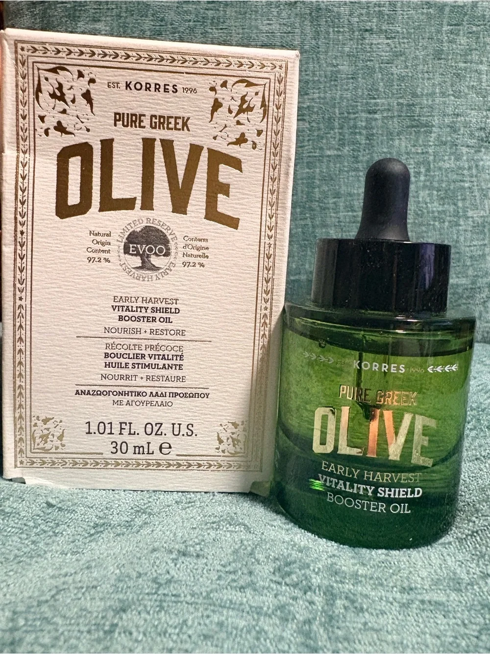 Korres Pure Greek Olive Vitality Shield Booster Oil — green and black